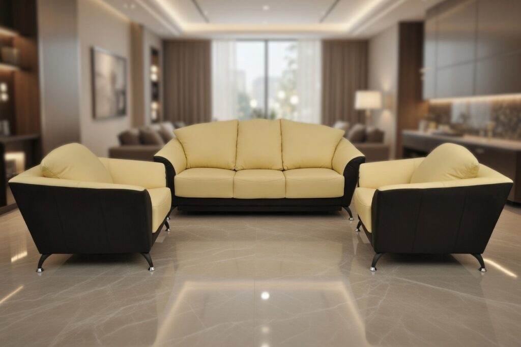 Zestaw żółto‑czarnych sof w nowoczesnym salonie z marmurową podłogą i dużym oknem.